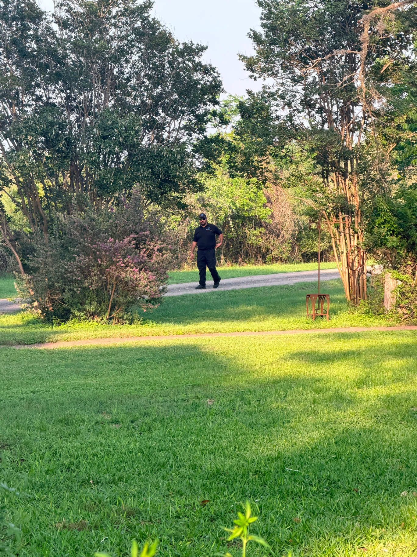 Shield Spire Security officer in uniform patrolling the grounds of a private East Austin birthday event.